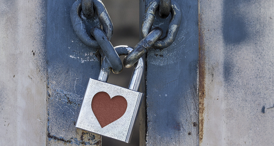 Photo of a padlock with a heart on it.