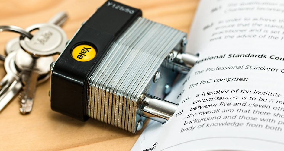 Image shows a document with a padlock and keys.